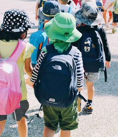 Children backpacks field trip school outing.