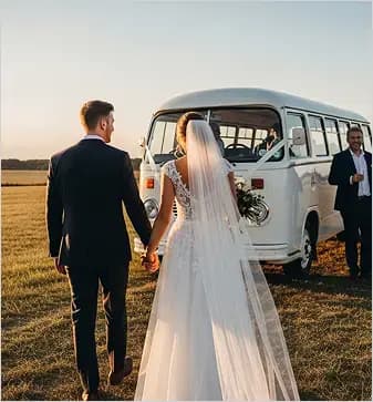 Wedding couple by minibus.